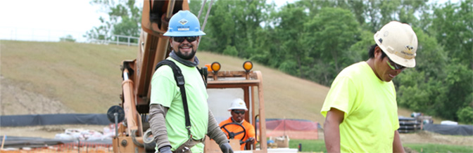 Two construction workers in hard hats